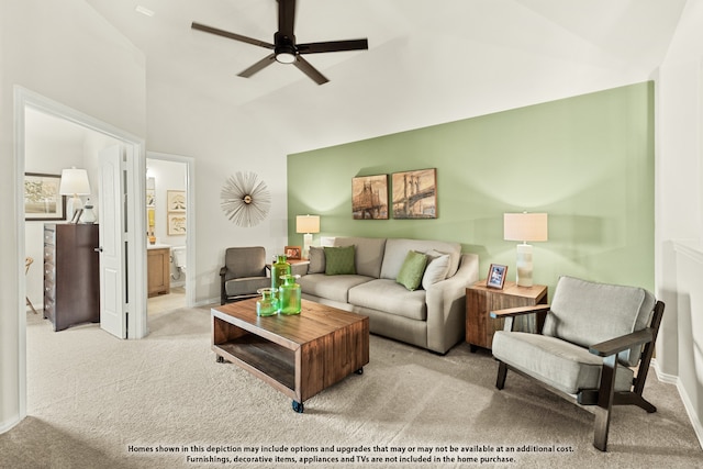 living room featuring ceiling fan, lofted ceiling, and light colored carpet