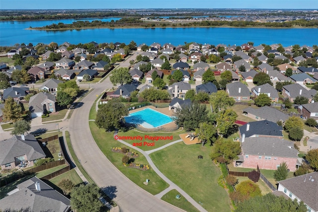 birds eye view of property with a water view