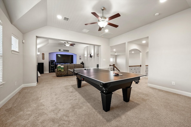 rec room with ceiling fan, lofted ceiling, and light carpet