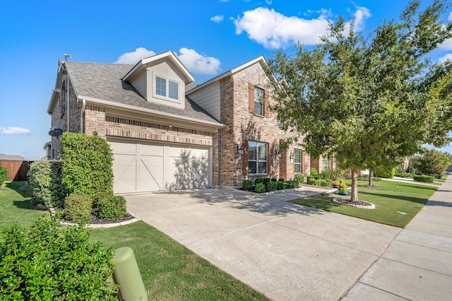 view of front of property featuring a garage and a front yard