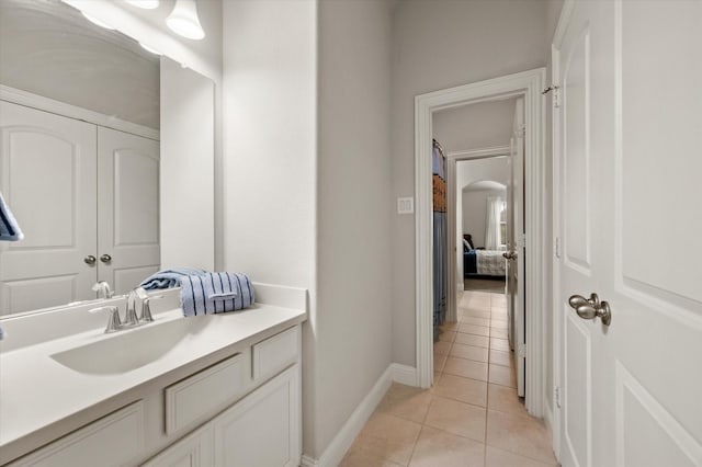 bathroom with vanity and tile patterned flooring