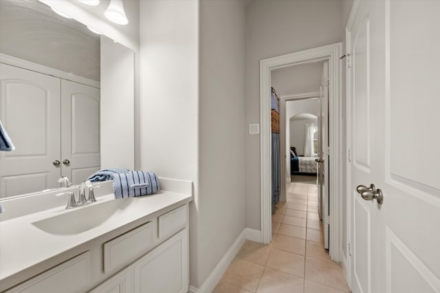 bathroom with tile patterned floors and vanity