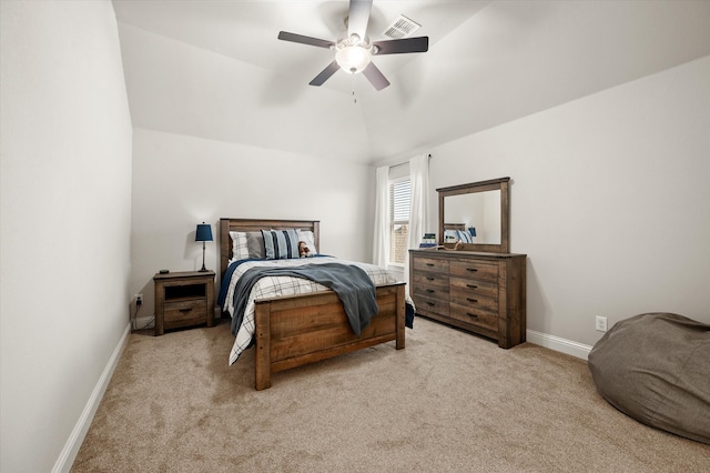 carpeted bedroom featuring ceiling fan and vaulted ceiling