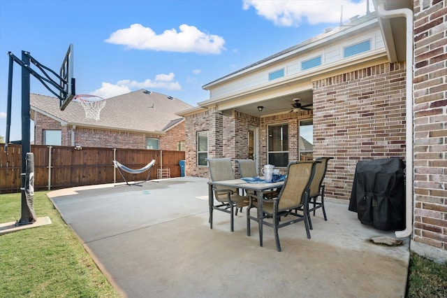 view of patio / terrace with ceiling fan and a grill