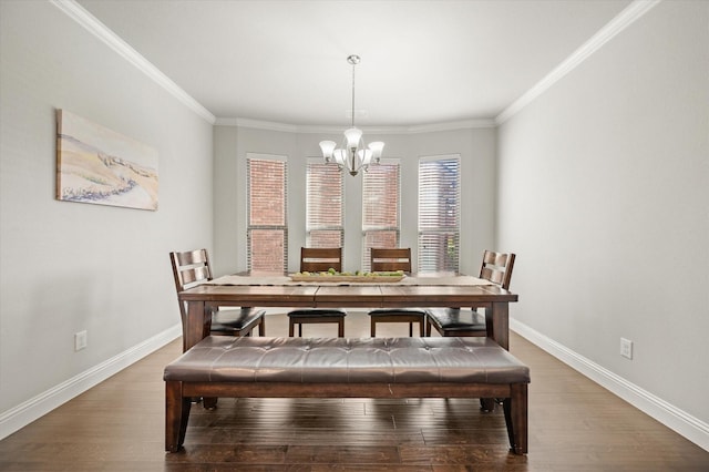 dining room with ornamental molding, an inviting chandelier, and wood-type flooring