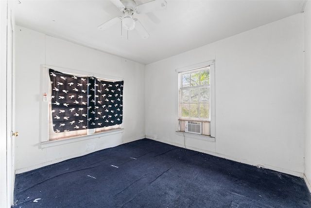 unfurnished room with ceiling fan, cooling unit, and dark carpet