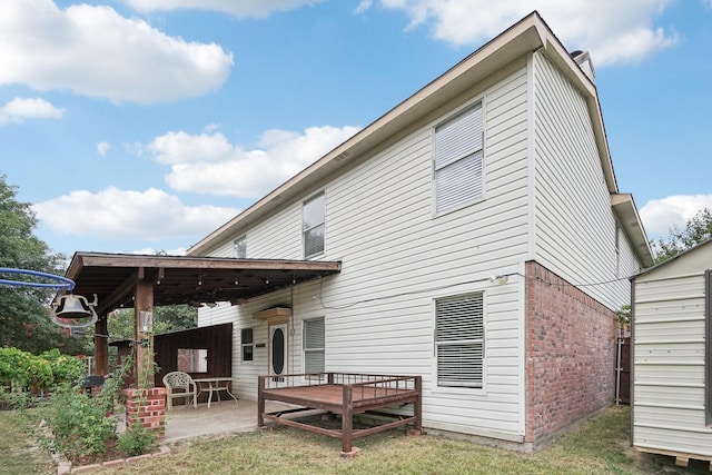 back of property featuring a patio