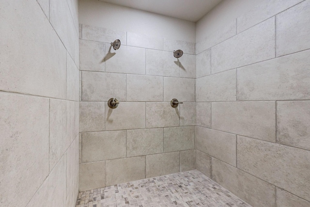 bathroom with a tile shower