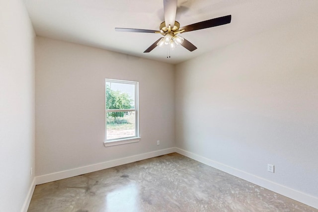 empty room featuring ceiling fan and concrete flooring