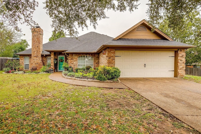 ranch-style house featuring a front yard and a garage