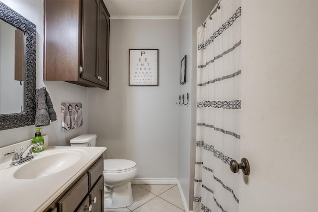 bathroom with toilet, vanity, tile patterned floors, and crown molding