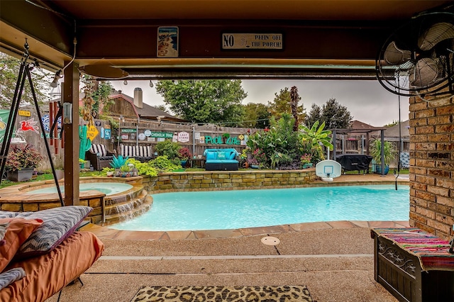 view of swimming pool featuring an in ground hot tub and pool water feature