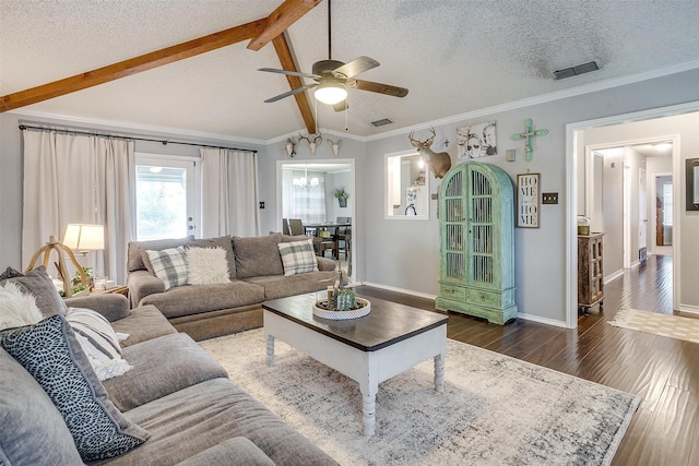 living room featuring ornamental molding, a textured ceiling, ceiling fan, lofted ceiling with beams, and dark hardwood / wood-style floors