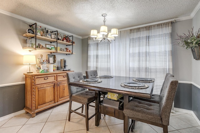 dining area with light tile patterned floors, ornamental molding, a textured ceiling, and a notable chandelier