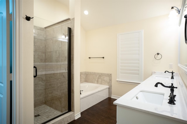 bathroom featuring vanity, shower with separate bathtub, and hardwood / wood-style floors