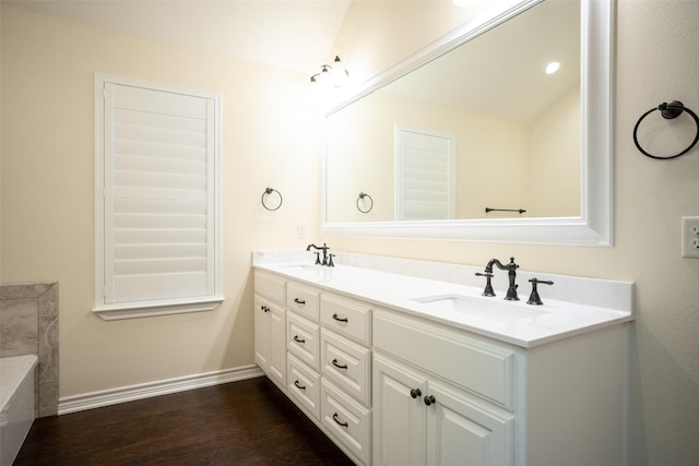 bathroom featuring vanity and wood-type flooring