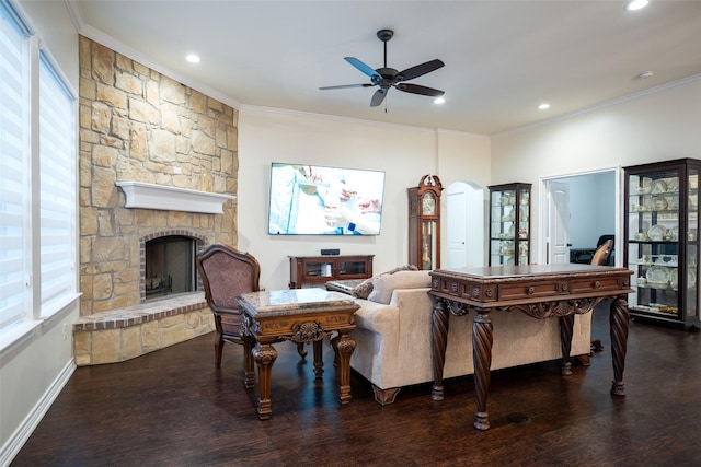 living room with dark hardwood / wood-style floors, a fireplace, and crown molding