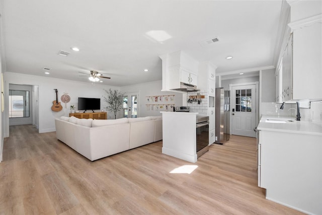 300 L S P Cir, Kerens, TX 75144 - kitchen with a sink, open floor plan, under cabinet range hood, white cabinets, and light countertops