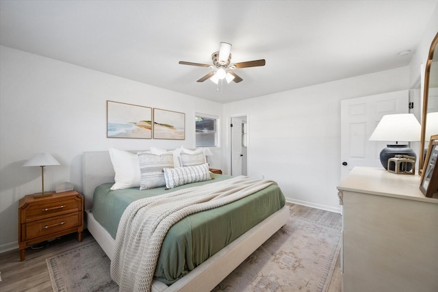 300 L S P Cir, Kerens, TX 75144 - bedroom with light wood finished floors, baseboards, and a ceiling fan