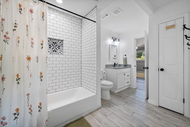 300 L S P Cir, Kerens, TX 75144 - bathroom with vanity, shower / tub combo, toilet, and wood finished floors