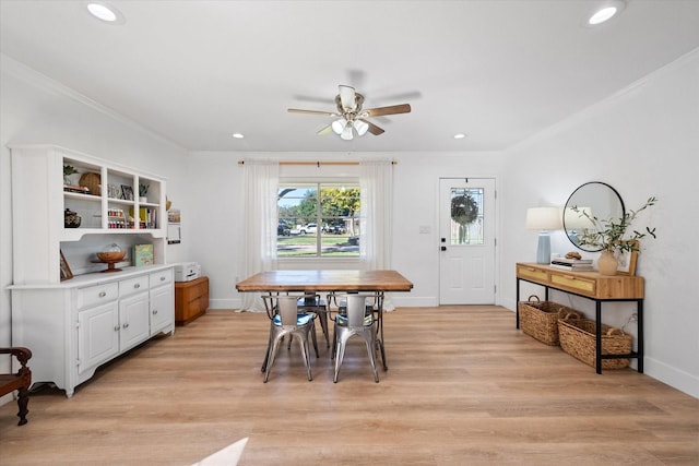 dining area with ornamental molding, ceiling fan, and light hardwood / wood-style floors