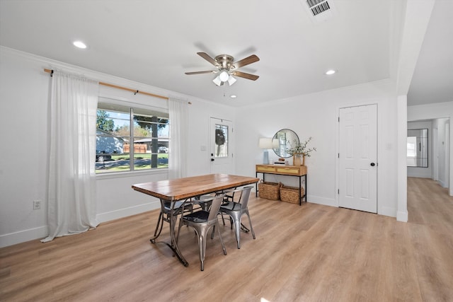 dining room featuring crown molding, ceiling fan, and light hardwood / wood-style floors