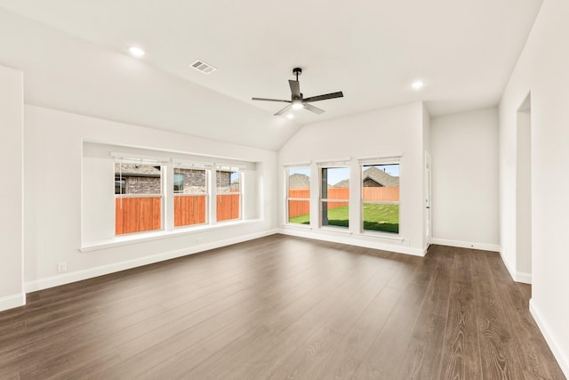 spare room featuring vaulted ceiling, dark hardwood / wood-style floors, and ceiling fan