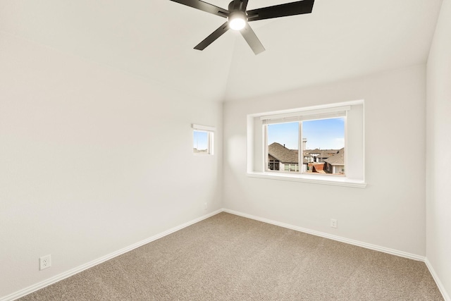 unfurnished room with ceiling fan, lofted ceiling, and carpet floors