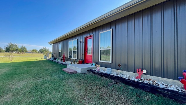 view of property exterior with a yard