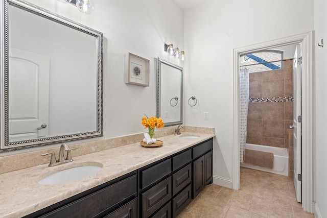 bathroom featuring vanity, tile patterned floors, and shower / bath combo with shower curtain