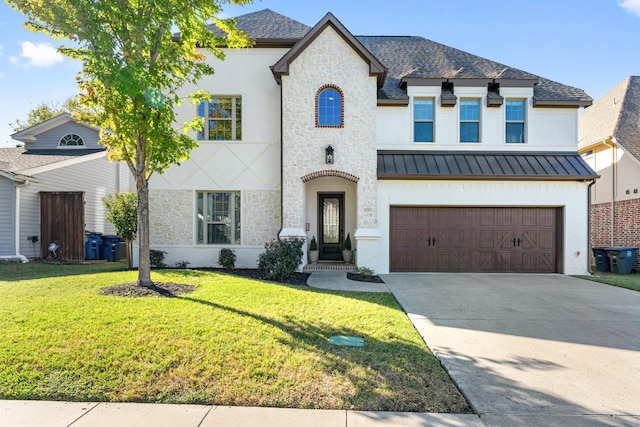 french country style house featuring a garage and a front yard