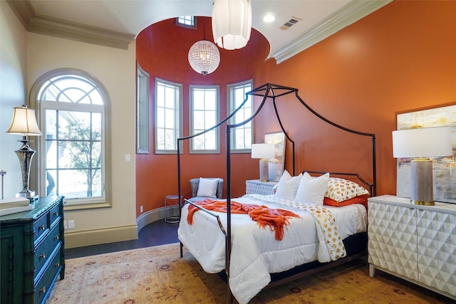 2009 E Highland St, Southlake, TX 76092 - bedroom with ornamental molding, multiple windows, wood finished floors, a chandelier, and baseboards