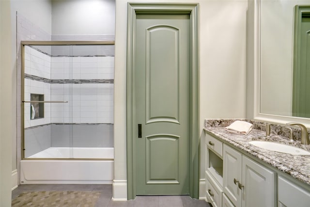 2009 E Highland St, Southlake, TX 76092 - bathroom featuring vanity, tile patterned flooring, and combined bath / shower with glass door