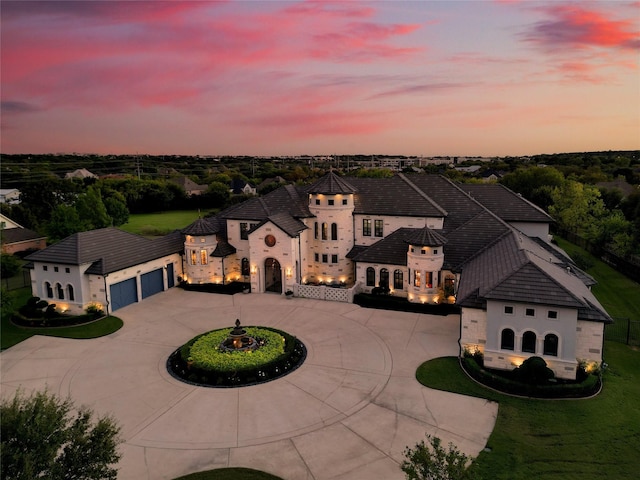 2009 E Highland St, Southlake, TX 76092 - view of front of house with curved driveway, stone siding, and a front yard