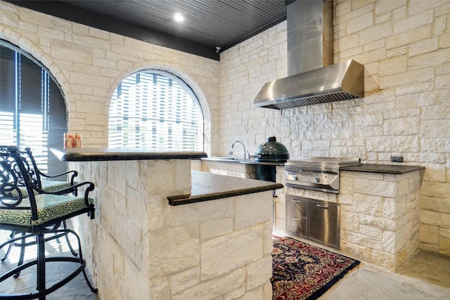 2009 E Highland St, Southlake, TX 76092 - kitchen with wall chimney range hood, plenty of natural light, dark countertops, and marble finish flooring