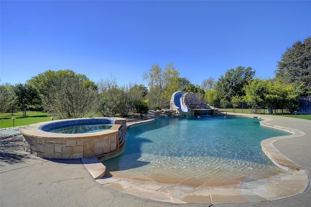 2009 E Highland St, Southlake, TX 76092 - view of pool featuring a water slide and a pool with connected hot tub