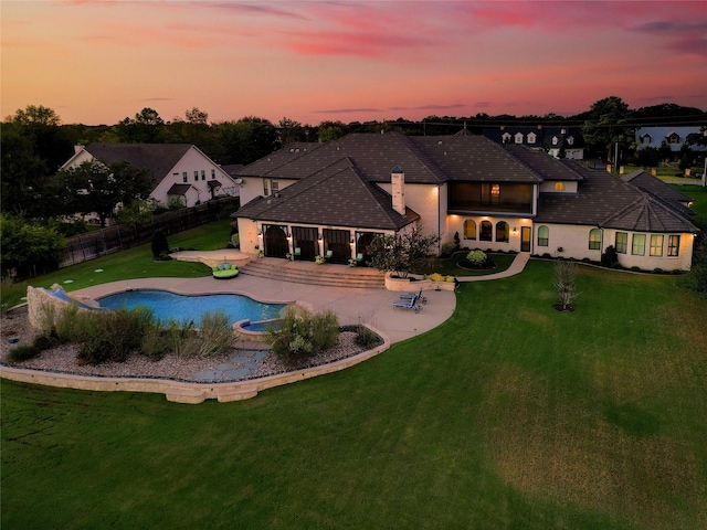 2009 E Highland St, Southlake, TX 76092 - pool at dusk with a patio area and a pool with connected hot tub