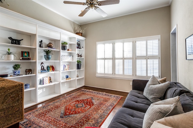 sitting room with ceiling fan, dark hardwood / wood-style floors, and ornamental molding