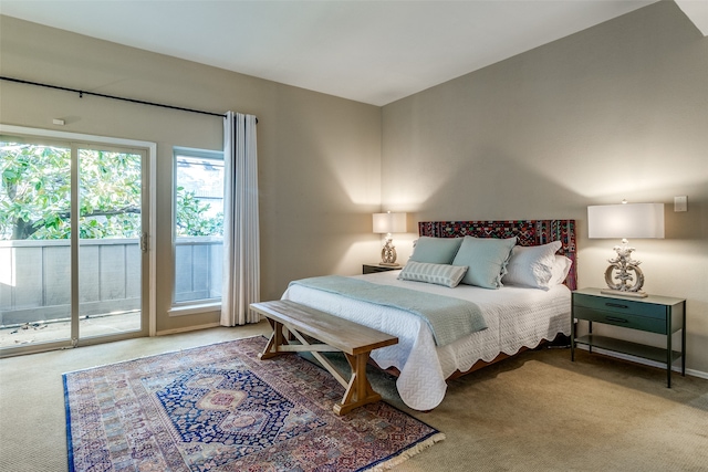 carpeted bedroom featuring access to exterior