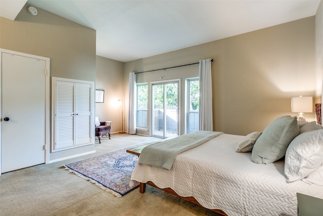 carpeted bedroom featuring access to exterior