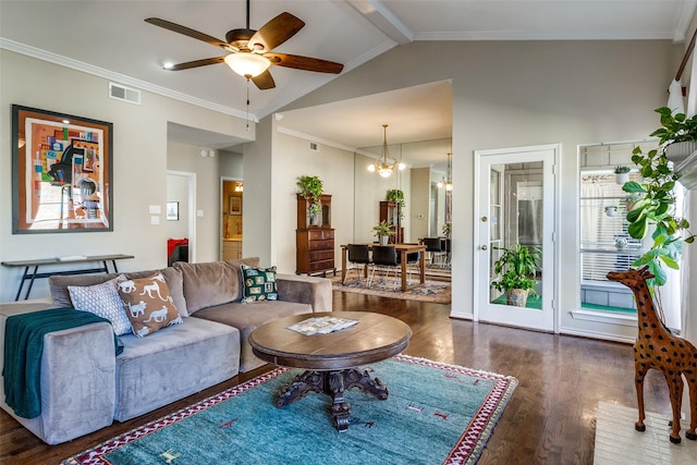 living room featuring dark hardwood / wood-style floors, crown molding, ceiling fan with notable chandelier, and a brick fireplace