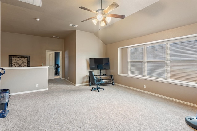 interior space with ceiling fan, light colored carpet, and lofted ceiling