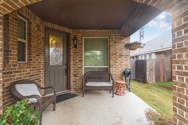 entrance to property featuring covered porch