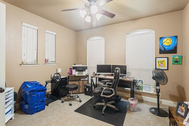 office space with carpet floors and ceiling fan