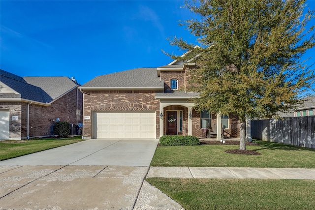 view of front of home with a garage, covered porch, and a front lawn