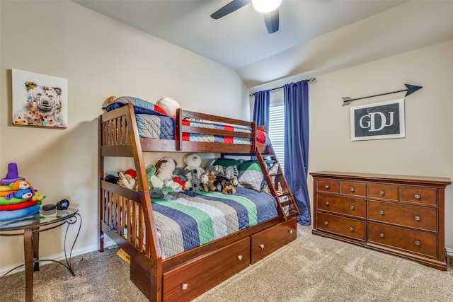 bedroom with ceiling fan, carpet floors, and vaulted ceiling