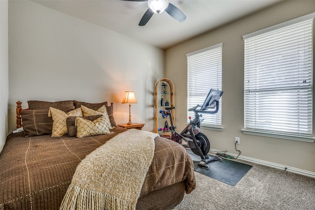 bedroom with ceiling fan and carpet floors