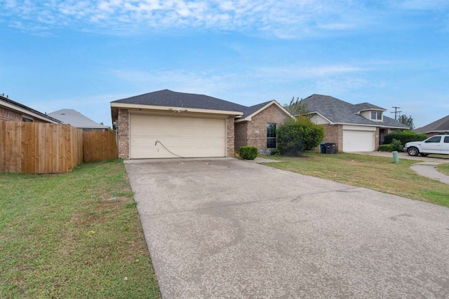 ranch-style home featuring a garage and a front lawn