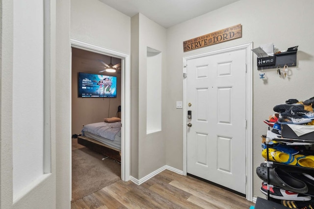 foyer entrance with light hardwood / wood-style flooring