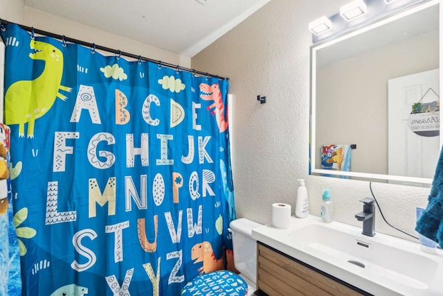 bathroom with vanity, toilet, and walk in shower